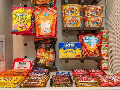a refrigerator filled with lots of different types of food at Comfort Inn West in Ottawa