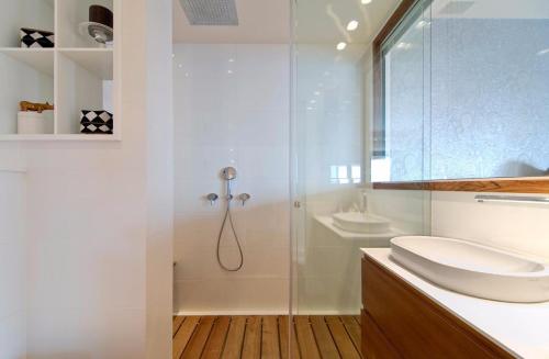 a bathroom with a glass shower and a sink at WONDERFUL LUXURY VILLA AT HERZLIYA PITUACH in Herzelia 