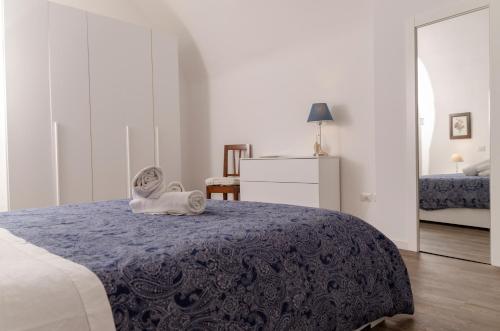 מיטה או מיטות בחדר ב-[ApuliaLux] Panta Rei Luxury House nel Centro Storico