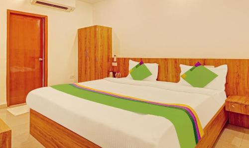 a bedroom with a large bed in a room at Treebo Silver Stallion in Lucknow