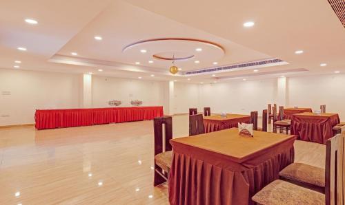 a banquet hall with tables and chairs in a room at Treebo Silver Stallion in Lucknow