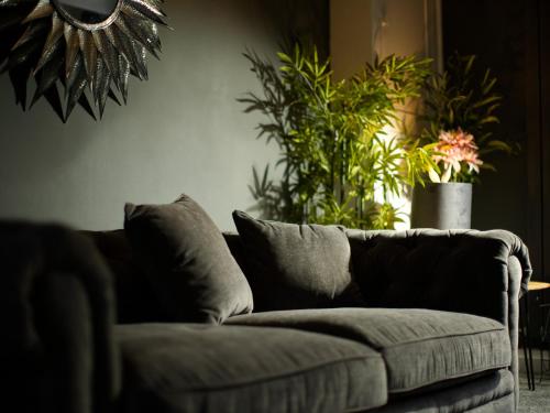 a living room with a couch and some plants at Beckdale in Pickering