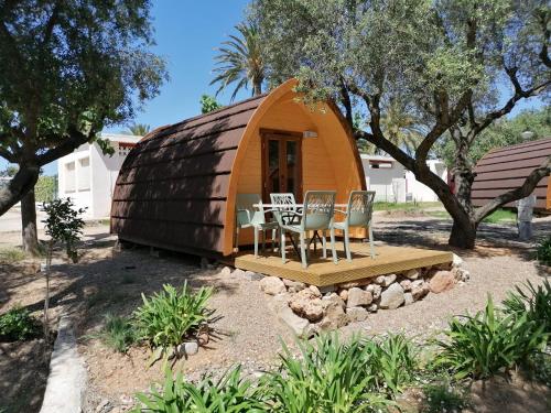 a dome house with a table and chairs in it at Camping Cambrils Caban in Cambrils