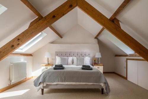 a bedroom with a bed in a attic at Snowdonia Holiday Cottage in Bala