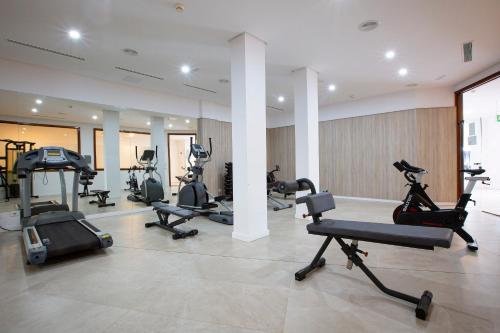 a gym with several treadmills and exercise bikes at Hipotels La Geria in Puerto del Carmen