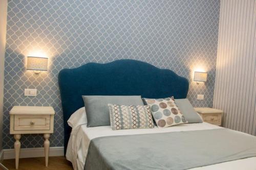 Кровать или кровати в номере Florita Napoli