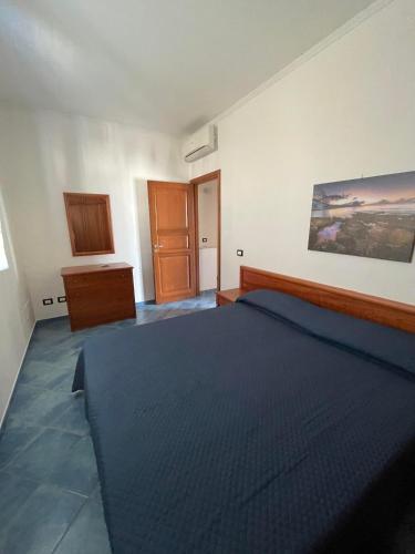 Postel nebo postele na pokoji v ubytování NEREA - Appartamento fronte mare