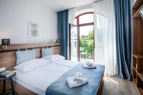 Postel nebo postele na pokoji v ubytování B&B Pod vrbo