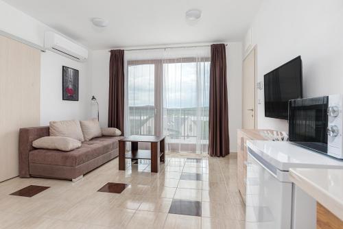 TV a/nebo společenská místnost v ubytování Hérics Apartman