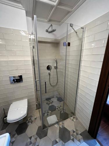 a bathroom with a shower and a toilet at HOTEL BOUTIQUE CASA CHITIC -HOTEL AND RESTAURANT Str Johann Gott nr7 in Braşov