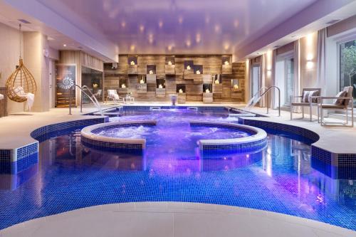 a swimming pool in a hotel lobby with a spa at St Michaels The Liner in Falmouth