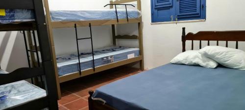 เตียงในห้องที่ Casa em Águas Belas CE