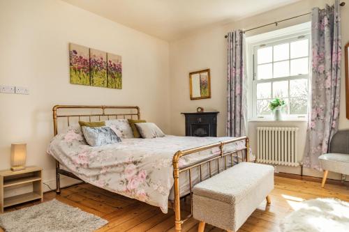 a bedroom with a bed and a window at Field View Apartment in Barnard Castle