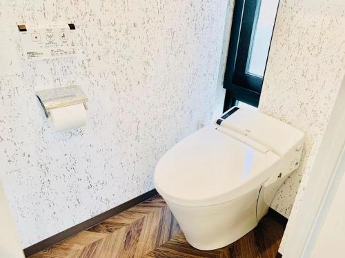 a bathroom with a white toilet in a room at TIME SHARING STAY Ikebukuro in Tokyo