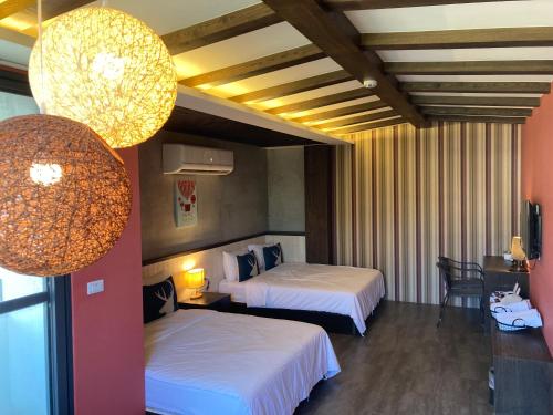 Giường trong phòng chung tại Chi Chu B&B