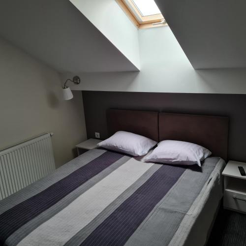 Posteľ alebo postele v izbe v ubytovaní Apartament Wileńska