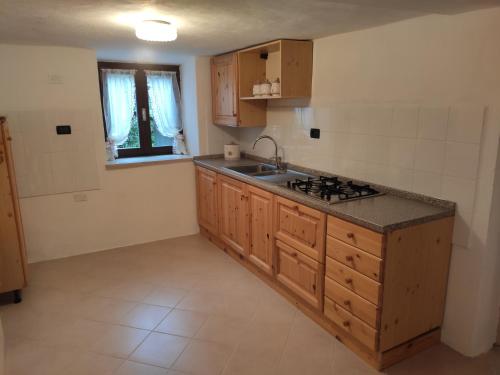 a kitchen with a sink and a counter top at Casa Gemma in Vignola