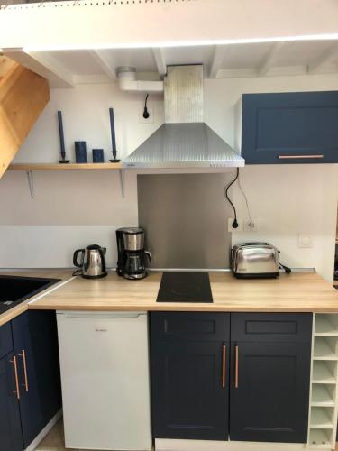 Kuchyň nebo kuchyňský kout v ubytování Quartier d'Emily in Paris