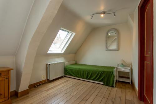 Ein Bett oder Betten in einem Zimmer der Unterkunft Coeur Saint-Jacques