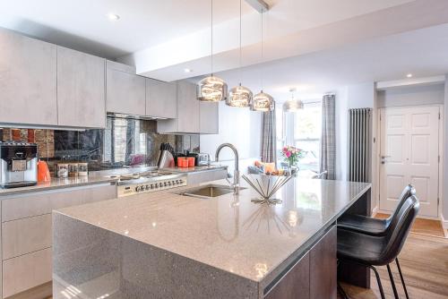 a kitchen with a large counter top in a room at The Picture House, Aldeburgh in Aldeburgh