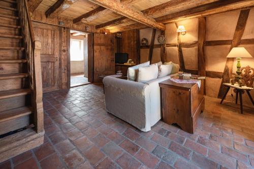 a bedroom with a bed and a table in a room at Au Fil du Temps in Imbsheim