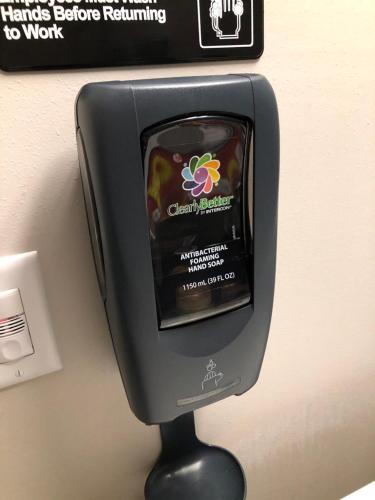 a small television is attached to a wall at Microtel Inn & Suites by Wyndham Carlisle in Carlisle