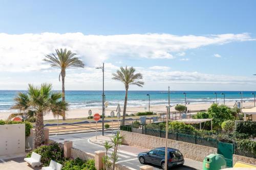 a view of the beach from the balcony of a condo at Very nice and modern studio front of the beach in El Campello