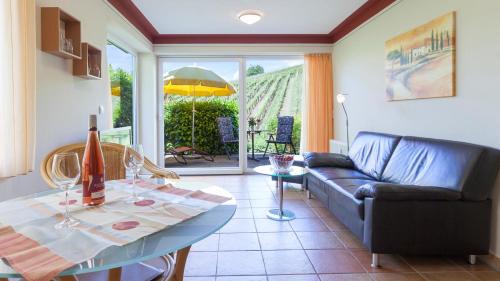 a living room with a couch and a table at Sonnenhof Hagnau in Hagnau