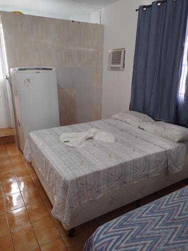 Postel nebo postele na pokoji v ubytování Pousada bandeirantes