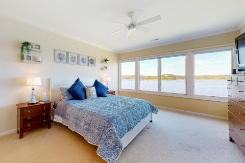 a bedroom with a bed and a large window at Bayville Shores -- 38221 Tidewater Court in Selbyville