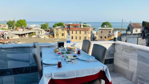 a table with plates of food on a balcony at The Old Ottoman Castle in Istanbul