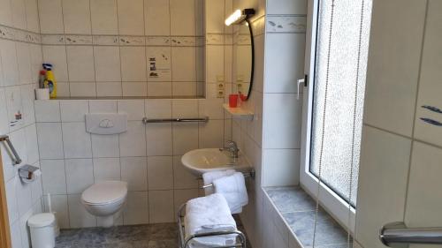 Salle de bains dans l'établissement Haus Borkumitte Appartement Poseidon