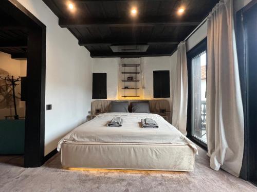 Ein Bett oder Betten in einem Zimmer der Unterkunft Bashtin Dom - Skabrin House