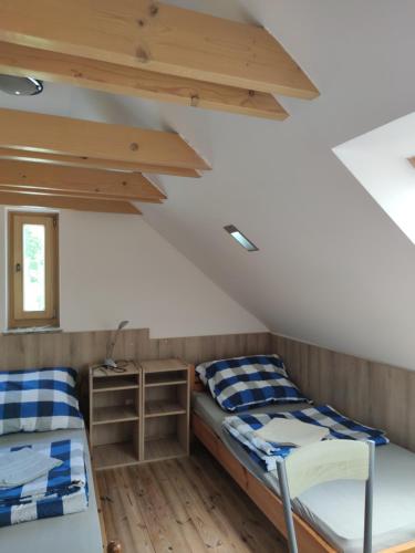 Postel nebo postele na pokoji v ubytování Malomkerék Vendégház
