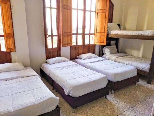 Hotel Colonial Manizalesにあるベッド