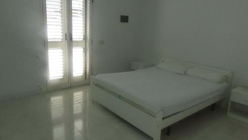 Tempat tidur dalam kamar di Villa Felicia