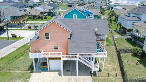 an aerial view of a house with a deck at Beautiful Front Row Views - Tiki Bar - Playground in Bolivar Peninsula