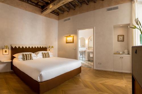 a bedroom with a large bed in a room at Casa G. Firenze in Florence