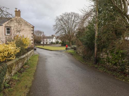 an empty road in front of a house at Rayside in Penrith