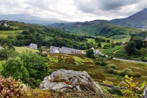 a view of a valley with houses and mountains at Mountain Walks Straight From The Doorstep in Blaenau-Ffestiniog