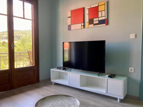 Televízia a/alebo spoločenská miestnosť v ubytovaní See Breeze Apartments - n.2