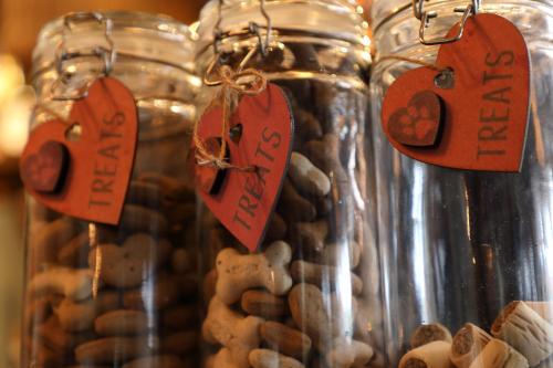 a bunch of glass jars filled with peanuts at Pont y Pair Inn in Betws-y-coed