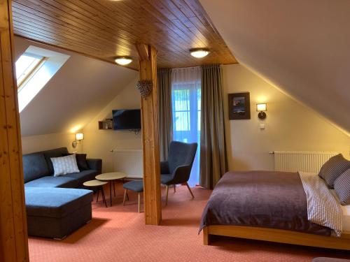 Postel nebo postele na pokoji v ubytování Chalet Hřebenka