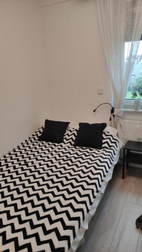 Postel nebo postele na pokoji v ubytování APARTAMENT TĘCZA II