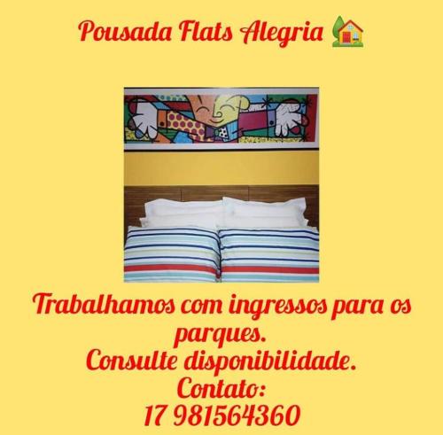 a poster for a hotel room with a bed at Pousada Flats Alegria in Olímpia