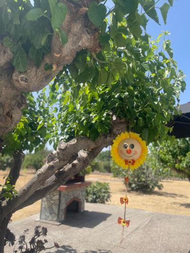 a sunflower decoration hanging from a tree at Aegean Endless Summer Villa Pefkos in Pefki Rhodes