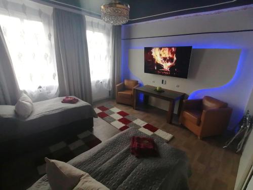 Postel nebo postele na pokoji v ubytování Best-Preis -Gold Suite- mit Netflix, Self-Check-In, eBike Ladestation, Fahrradraum, WLAN, Netflix und Massagesessel - direkt am Elberadweg im Herzen von Wittenberge