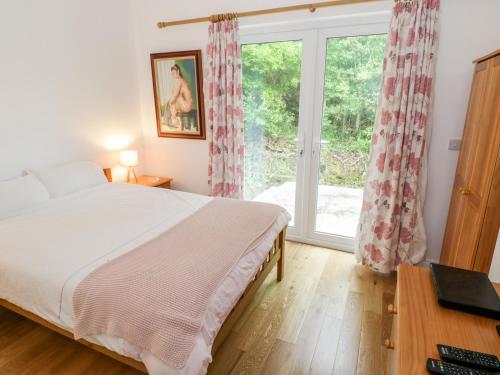 Postel nebo postele na pokoji v ubytování Rainbows End