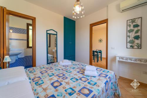 Katil atau katil-katil dalam bilik di Borgo Marino Beach Residence