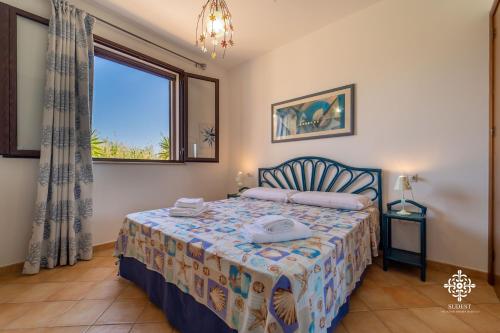 Katil atau katil-katil dalam bilik di Borgo Marino Beach Residence